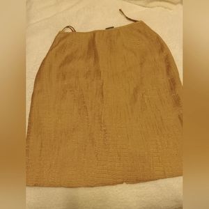A beige raw silk skirt